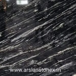 Markino Black Granite slab with deep black base and white flowing wave pattern from India