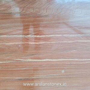 Teakwood Granite showing natural wood-like texture with light brown colour and black lines used for wall cladding