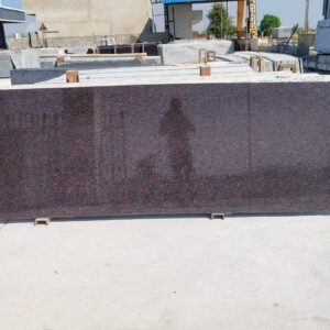 Cat Eye Granite slab with red-brown base and black mineral pattern by Granite slab supplier India