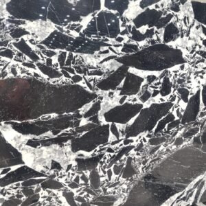 Nero Grand Antique marble slab with bold black and white pattern from a marble and granite supplier in India